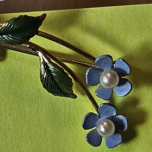 Elegant Signed Krementz Floral Brooch with Blue and Green Accents